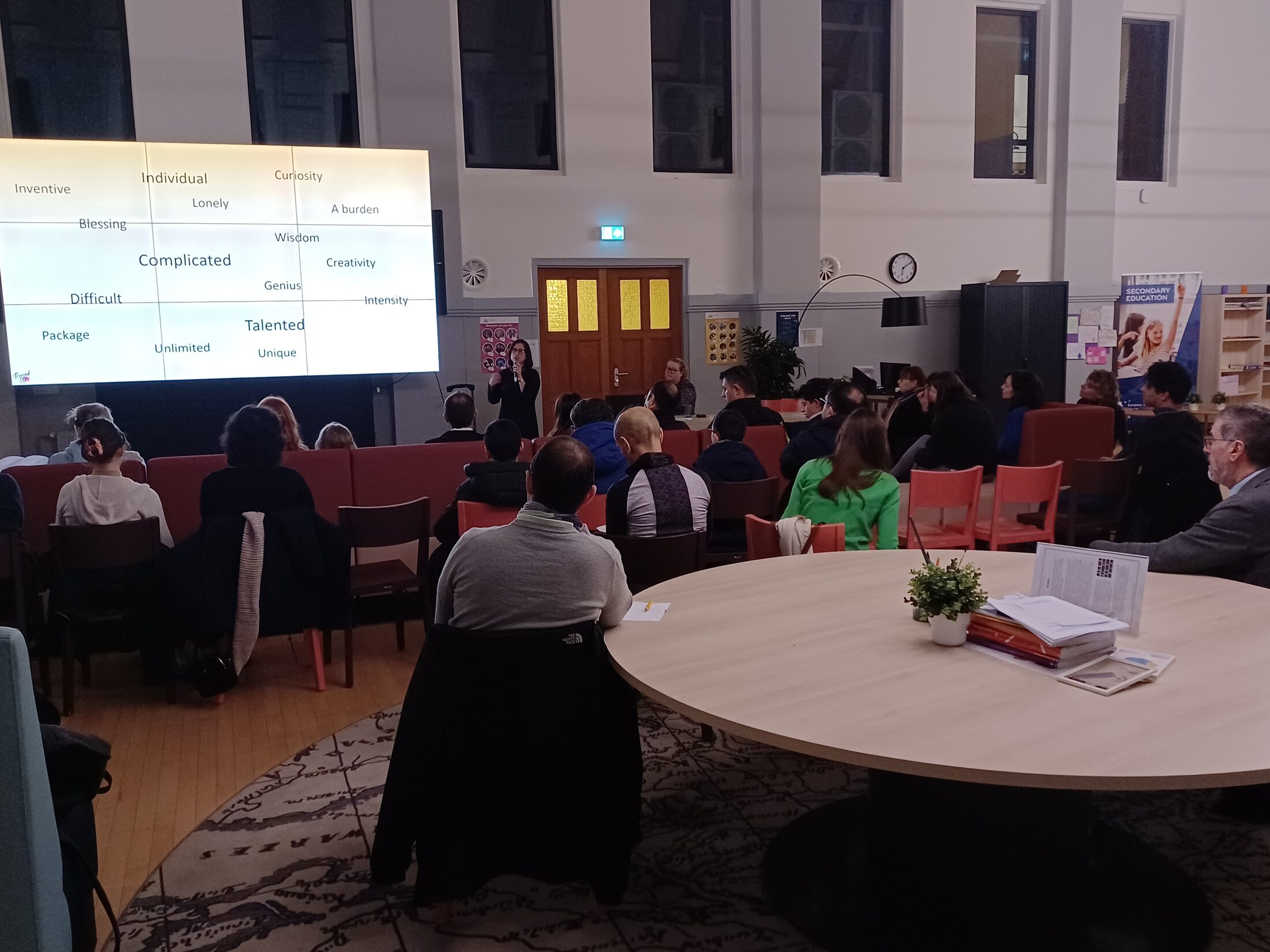 A full room of staff taking part in a gifted education workshop