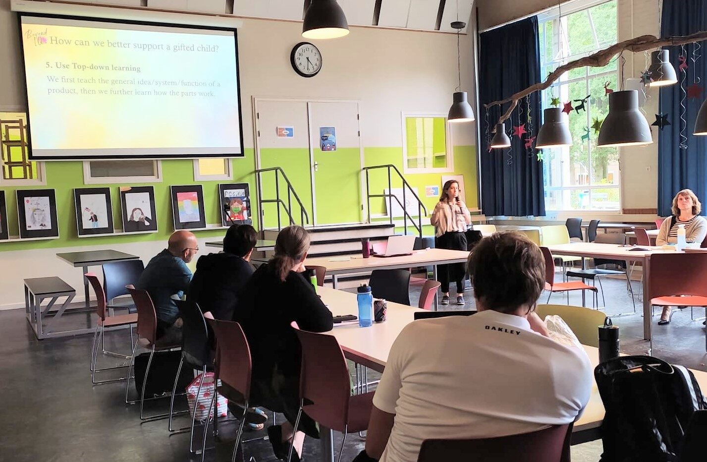 Staff listening and taking notes during a Beyond IQ workshop