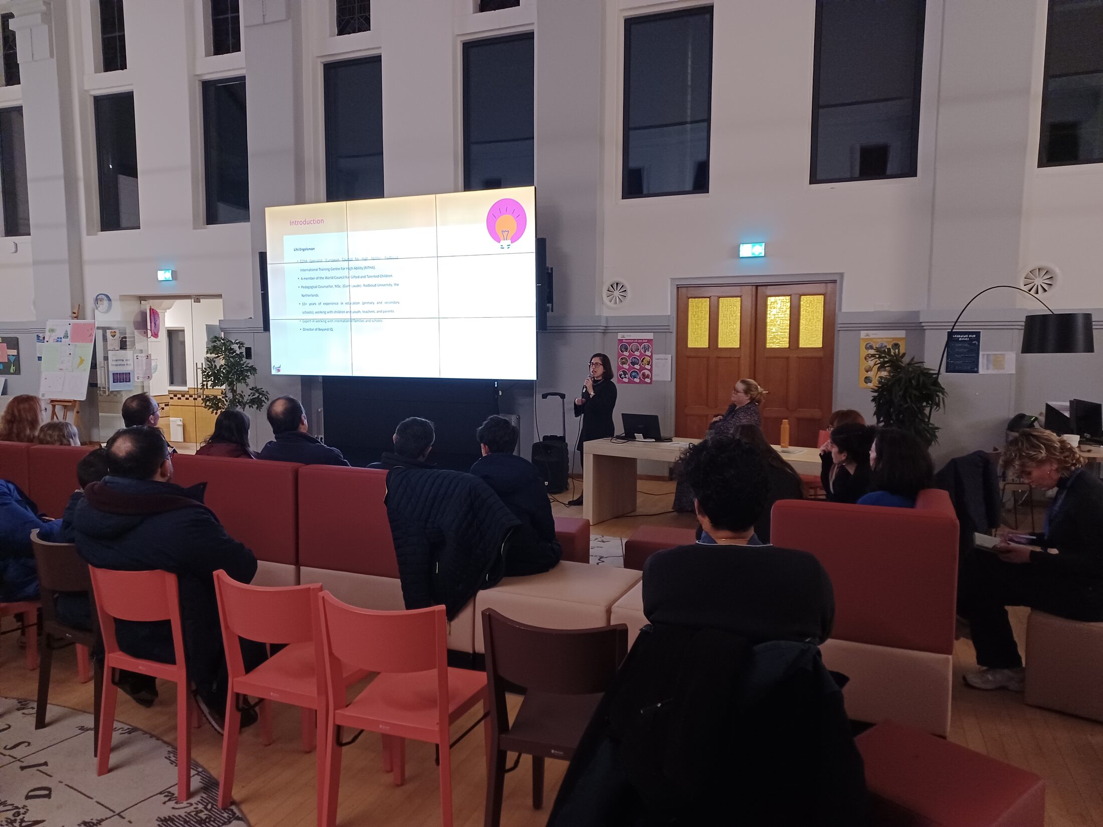 Teachers seated in a school hall during a Beyond IQ training session